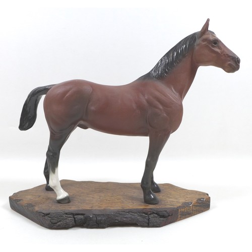 129 - A large Beswick horse, with short cropped tail and white rear left sock, bay - matt, 29cm high, stuc... 