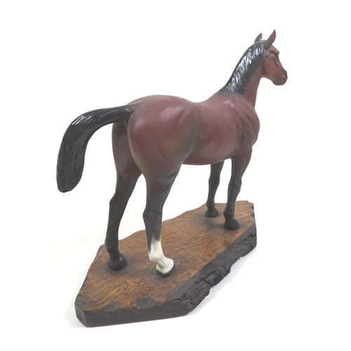 129 - A large Beswick horse, with short cropped tail and white rear left sock, bay - matt, 29cm high, stuc... 