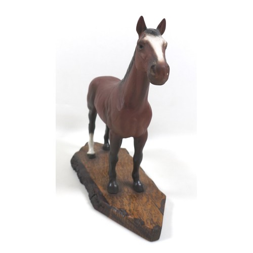 129 - A large Beswick horse, with short cropped tail and white rear left sock, bay - matt, 29cm high, stuc... 