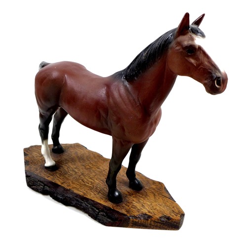 129 - A large Beswick horse, with short cropped tail and white rear left sock, bay - matt, 29cm high, stuc... 