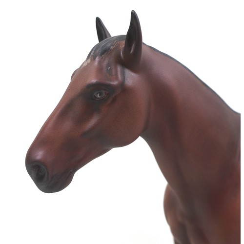 130 - A Beswick 'Nijinsky' horse figurine, from the 'Connoisseur Horses' series, model 2345, on wooden pli... 