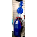 A group of six blue, red and black moulded plastic sledges, with blue rope pulls.