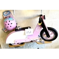 A KiddiMoto children's wooden balance bike, in the form of a pink and white 'Vespa' style moped, tog... 