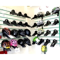 A group of fourteen helmets, various sizes and colours, together with thiry two slatwall mounting he... 