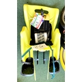 A Bellelli Little Duck Reflex yellow rear fixed mount child's seat.