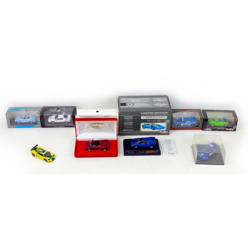 80 - A group of eight 1/43 scale die-cast model cars, including a Minichamps BMW M1 Street and a Karmann ... 