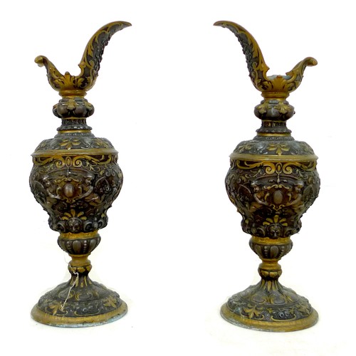 90 - A pair of early to mid 20th century metal ewers, a/f missing handles, in Italian style decorated in ... 