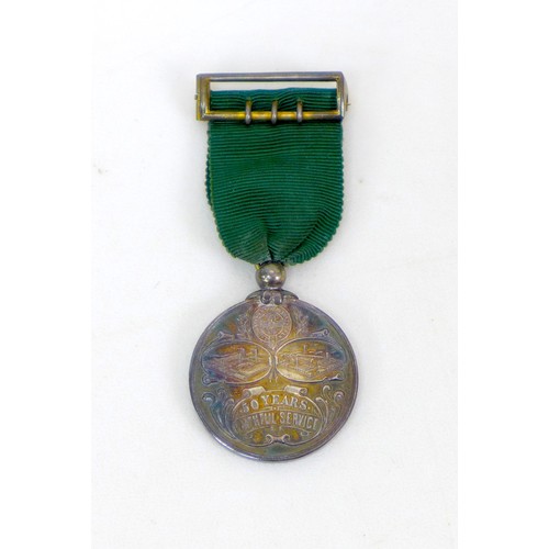 104 - A group of militaria, medals and collectables, including a WWII Defence medal, a silver Ruston & Hor... 