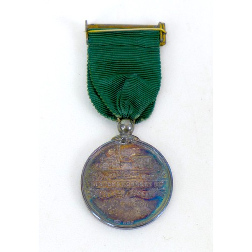 104 - A group of militaria, medals and collectables, including a WWII Defence medal, a silver Ruston & Hor... 