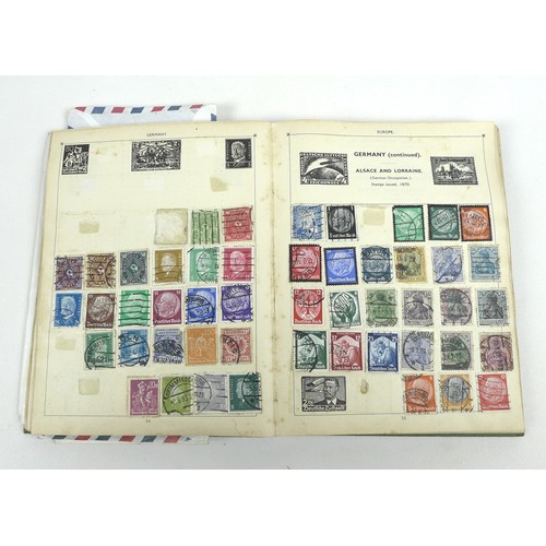 124 - A collection of stamps and postcards, including some military and topographical, in four stamp album... 