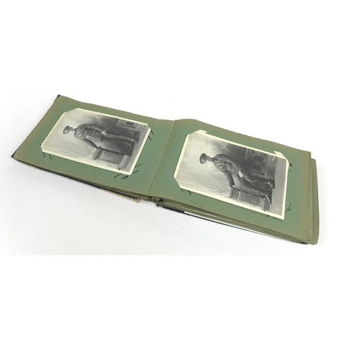 124 - A collection of stamps and postcards, including some military and topographical, in four stamp album... 