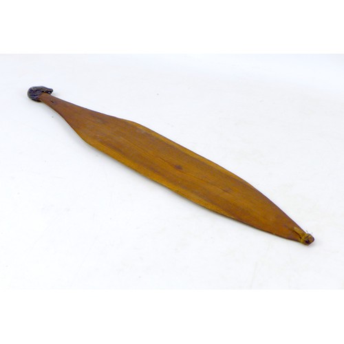 131 - Two early 20th century Aboriginal style woomerah spear throwers, comprising a hand painted example, ... 