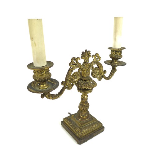 100A - A French late 19th century gilt metal twin branch table lamp, with floral scrolling decoration and c... 