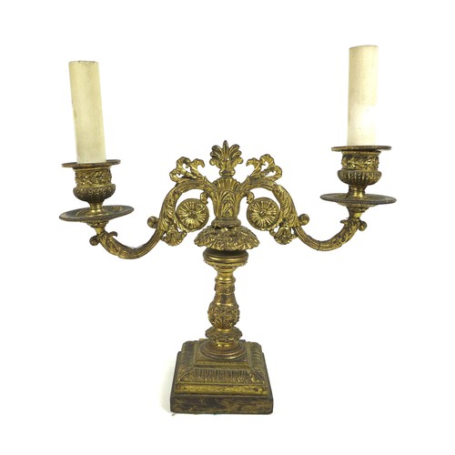 100A - A French late 19th century gilt metal twin branch table lamp, with floral scrolling decoration and c... 