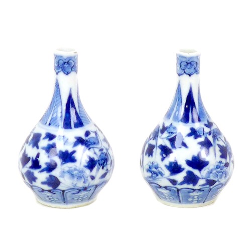 57 - A pair of small Chinese porcelain gourd vases, late 19th century, decorated in underglaze blue Ming ... 