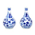 A pair of small Chinese porcelain gourd vases, late 19th century, decorated in underglaze blue Ming ... 