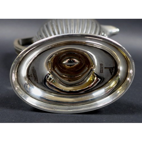 49 - A George V four piece silver tea service, all with half reeded lower bodies, comprising a teapot wit... 
