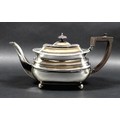 An Edward VII silver teapot, of London shape with decorative gadrooned upper rim, hinged cover with ... 
