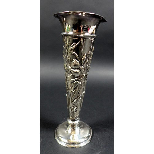 16 - A pair of Victorian silver spill vases, with flared rims and enbossed floral designed stems and weig... 