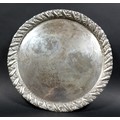 A 800 silver circular tray, with plain centre and gadrooned rim, 17.3toz / 539.4g, 27.5cm.