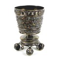 A late 19th century Russian silver cup, with tapering body raised on a short column above a circular... 