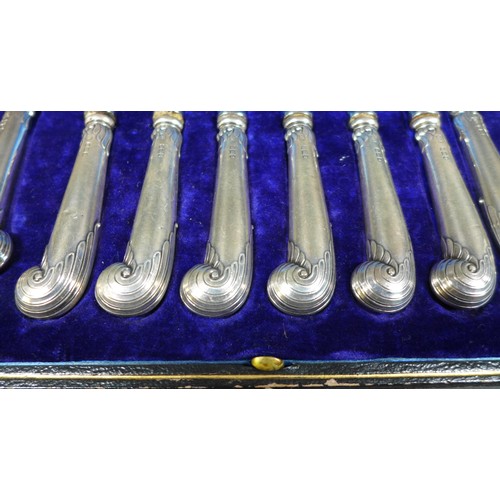 31 - A set of six silver pistol handled dessert knives and forks, George Howson, Sheffield 1912, stainles... 