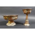 Two similar Tibetan copper and silver plated footed bowls, 19th or early 20th century, decorated wit... 