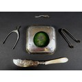 A group of silver items, comprising a pair of wishbone tongs, James Swann & Son, Birmingham 1944, 8c... 