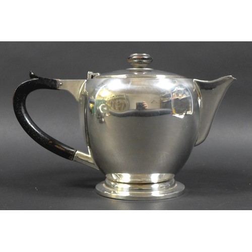 46 - An Art Deco Indian Colonial silver three piece tea set, by Warner Bros, comprising teapot with eboni... 