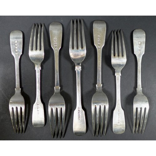 28 - Seven William IV and later silver fiddle back table forks, all with a single initial engraved to the... 