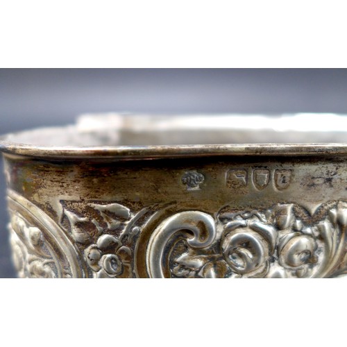 42 - A group of Victorian and later silver dressing table items, many with repousse decoration, comprisin... 