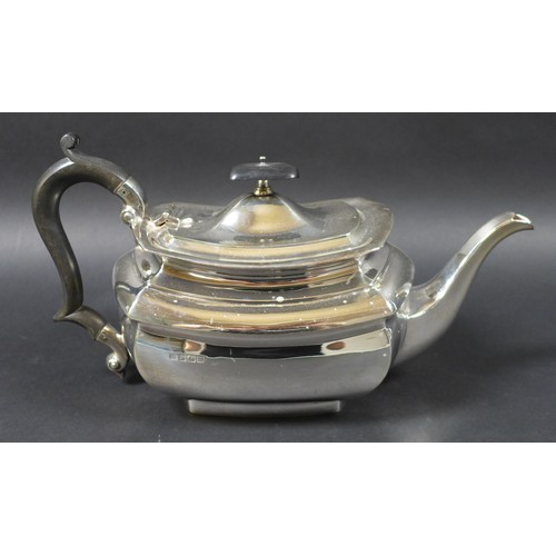 43 - An Edward VII silver three piece tea service, of London shape, comprising teapot with ebonised woode... 
