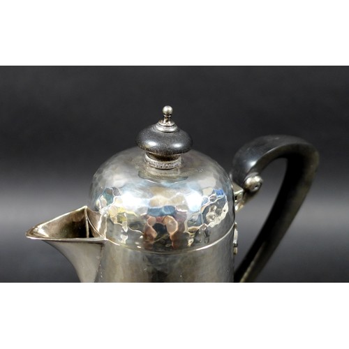 38 - An Edward VII silver hot water or chocolate pot, in Arts & Crafts taste, of tapering cylindrical for... 