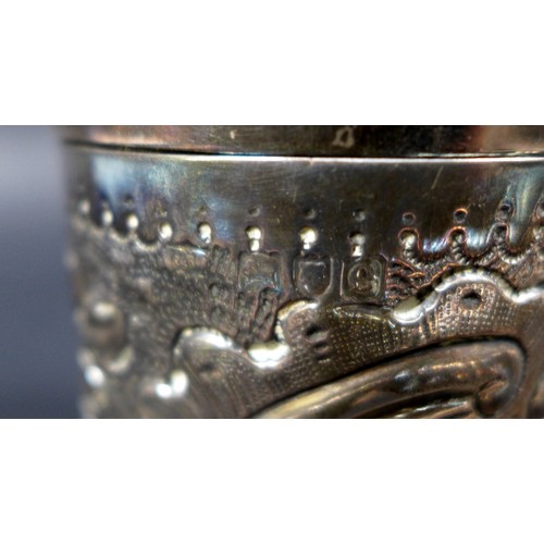 35 - A mixed collection of silver items, comprising a Victorian repousse cylindrical lidded pot, two ciga... 