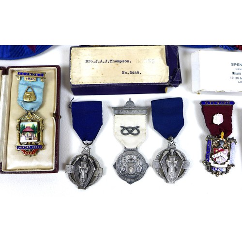 56 - A collection of mid-20th century Masonic medallions and ephemera, including five silver medallions, ... 