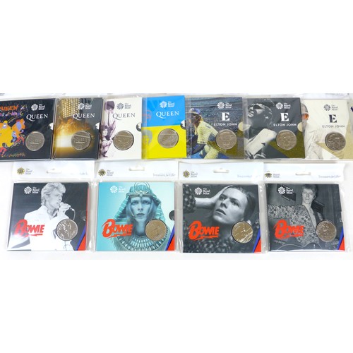 106 - A group of thirty two Elizabeth II brilliant uncirculated cupro-nickel coin sets, including twelve £... 