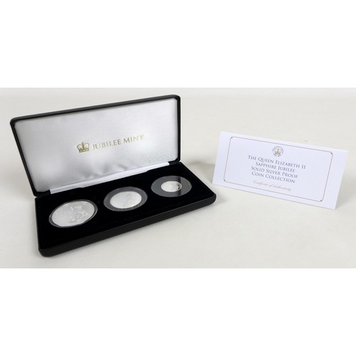 127 - Three Elizabeth II Jubilee mint commemorative silver proof coin sets, comprising three £5, £2 and £1... 