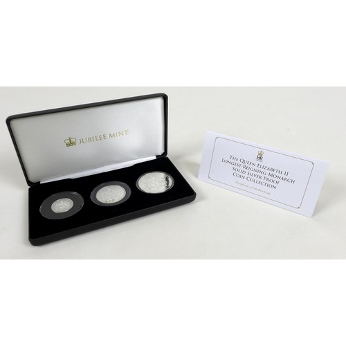 127 - Three Elizabeth II Jubilee mint commemorative silver proof coin sets, comprising three £5, £2 and £1... 