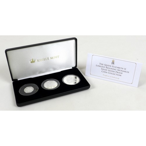 128 - Three Elizabeth II Jubilee mint commemorative silver proof coin sets, comprising three £5, £2 and £1... 