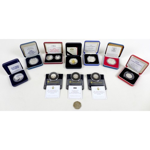 121 - A group of eleven Elizabeth II silver coins, including a 2006 East India Company fine silver 1oz gui... 