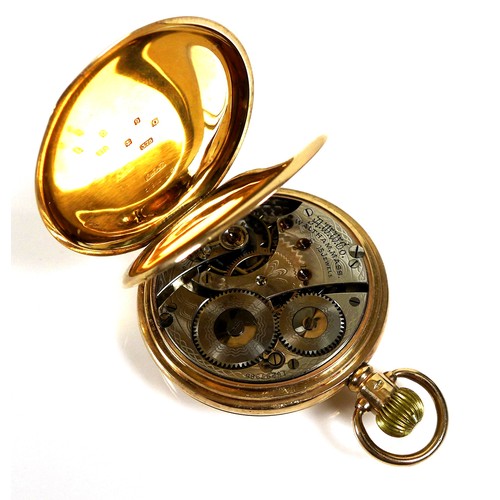 65 - A 9ct gold Waltham half hunter pocket watch, with Roman numeral dial and subsidiary dial, a top wind... 