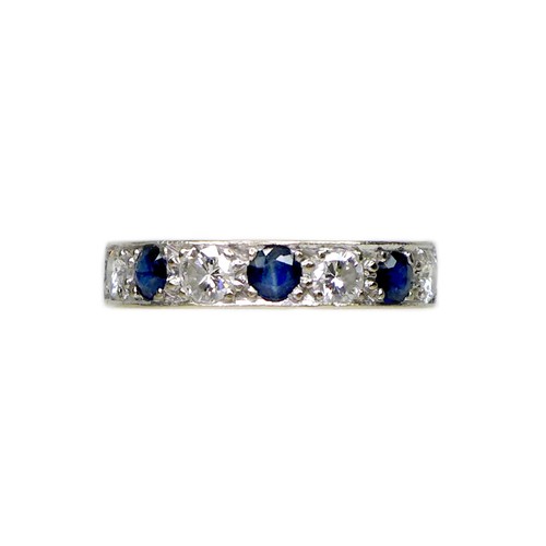 374 - An 18ct white gold, sapphire and diamond seven stone ring, the three round cut sapphires, each 4mm, ... 