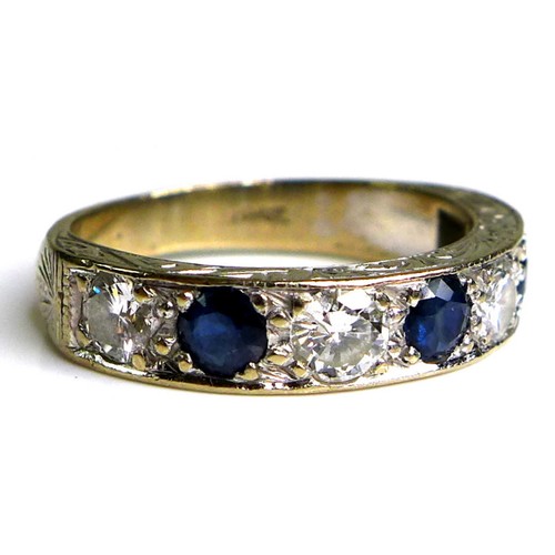 374 - An 18ct white gold, sapphire and diamond seven stone ring, the three round cut sapphires, each 4mm, ... 