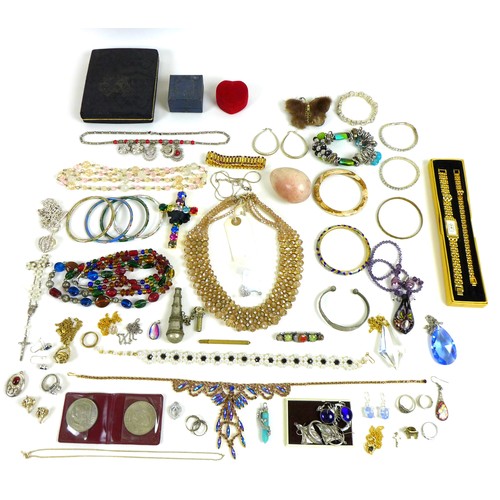 236 - A group of costume jewellery, comprising necklaces, brooches, earrings, bangles, rings, coins and a ... 