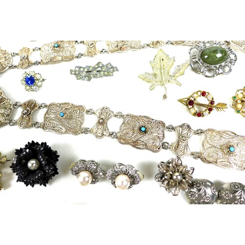 244 - A group of costume jewellery and medals, including compacts, faux pearl necklaces, silver brooches, ... 