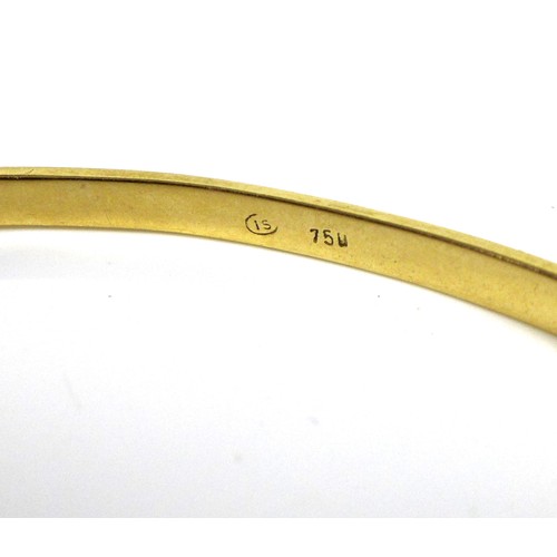 372 - An 18ct gold and diamond bangle, set with thirteen graduated brilliant cut stones, hinge clasp, 6cm ... 