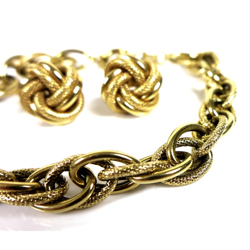 369 - An Italian 18ct gold textured link bracelet, 19.5cm long, with matching knot style stud earrings, bo... 