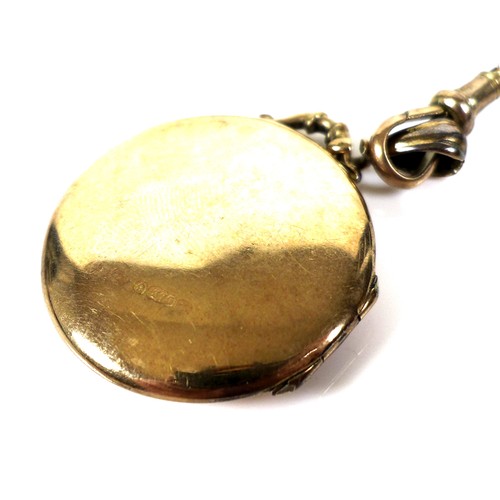 363 - A 9ct gold locket, 6.3g, on a long 9ct gold chain, 22.5g, 58.5cm long. (2)