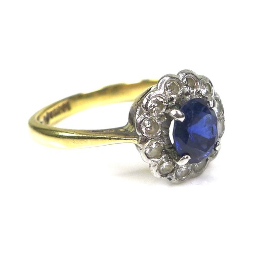 364 - An 18ct yellow gold and platinum, sapphire and diamond flowerhead ring, the central oval cut Royal b... 