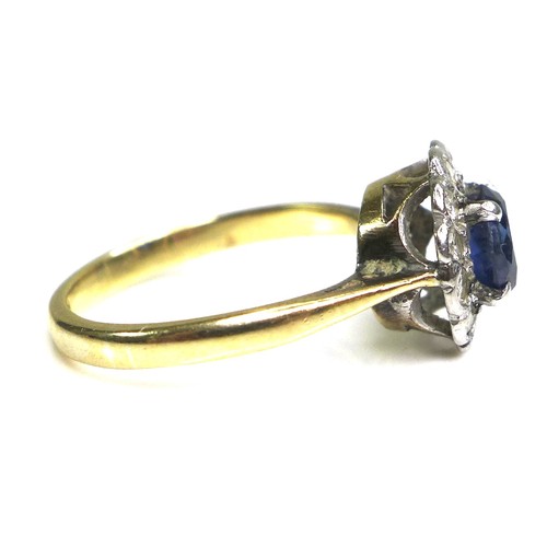 364 - An 18ct yellow gold and platinum, sapphire and diamond flowerhead ring, the central oval cut Royal b... 